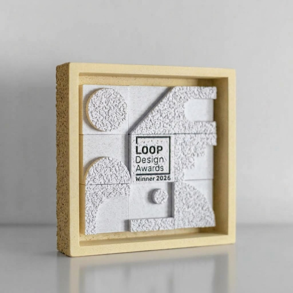 LOOP Design Awards trophy 2026 — stone frame with sculpted white tiles and the Winner 2026 plaque
